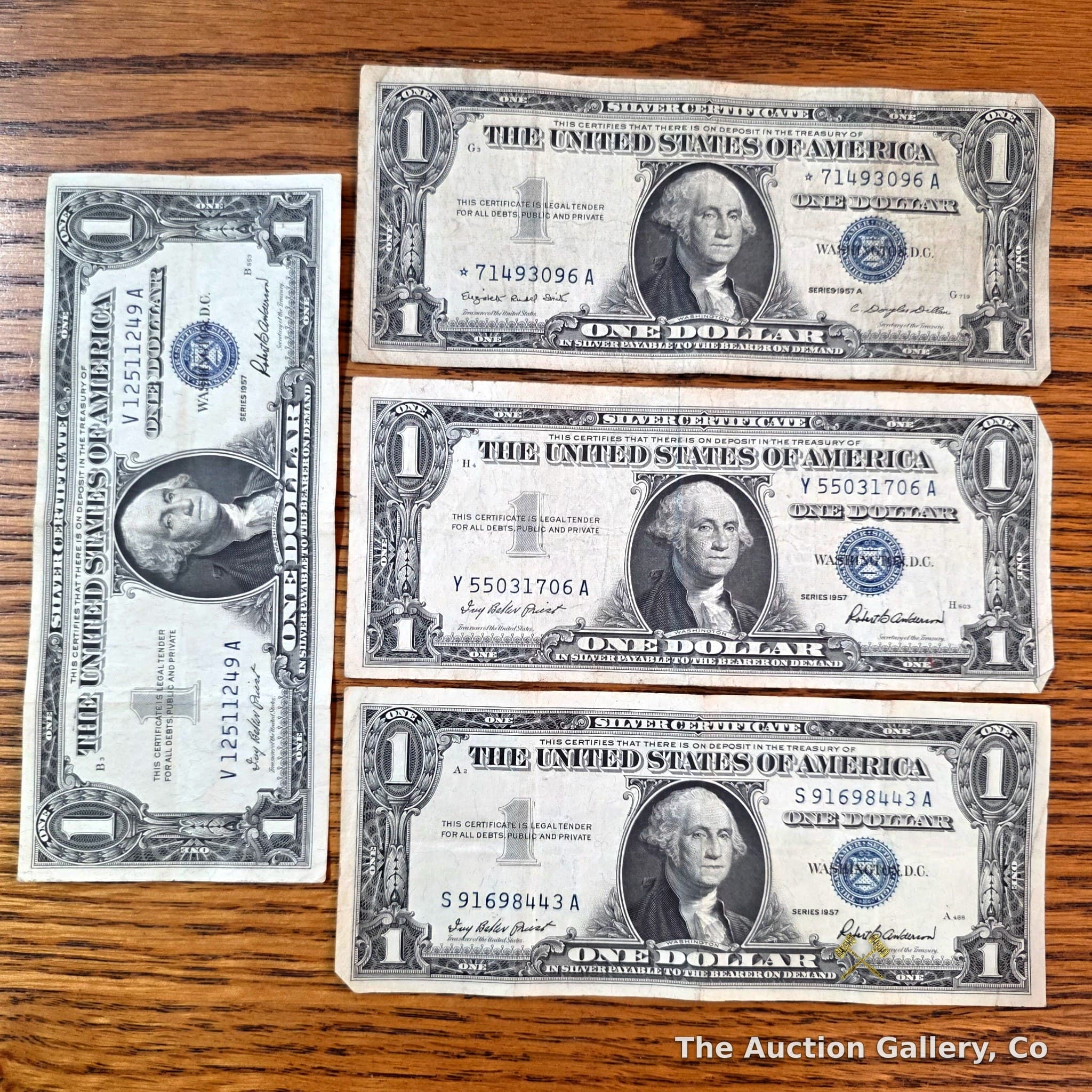 Series 1957 $1 Silver Certificates, Lot of 4 โ Includes Star Note
