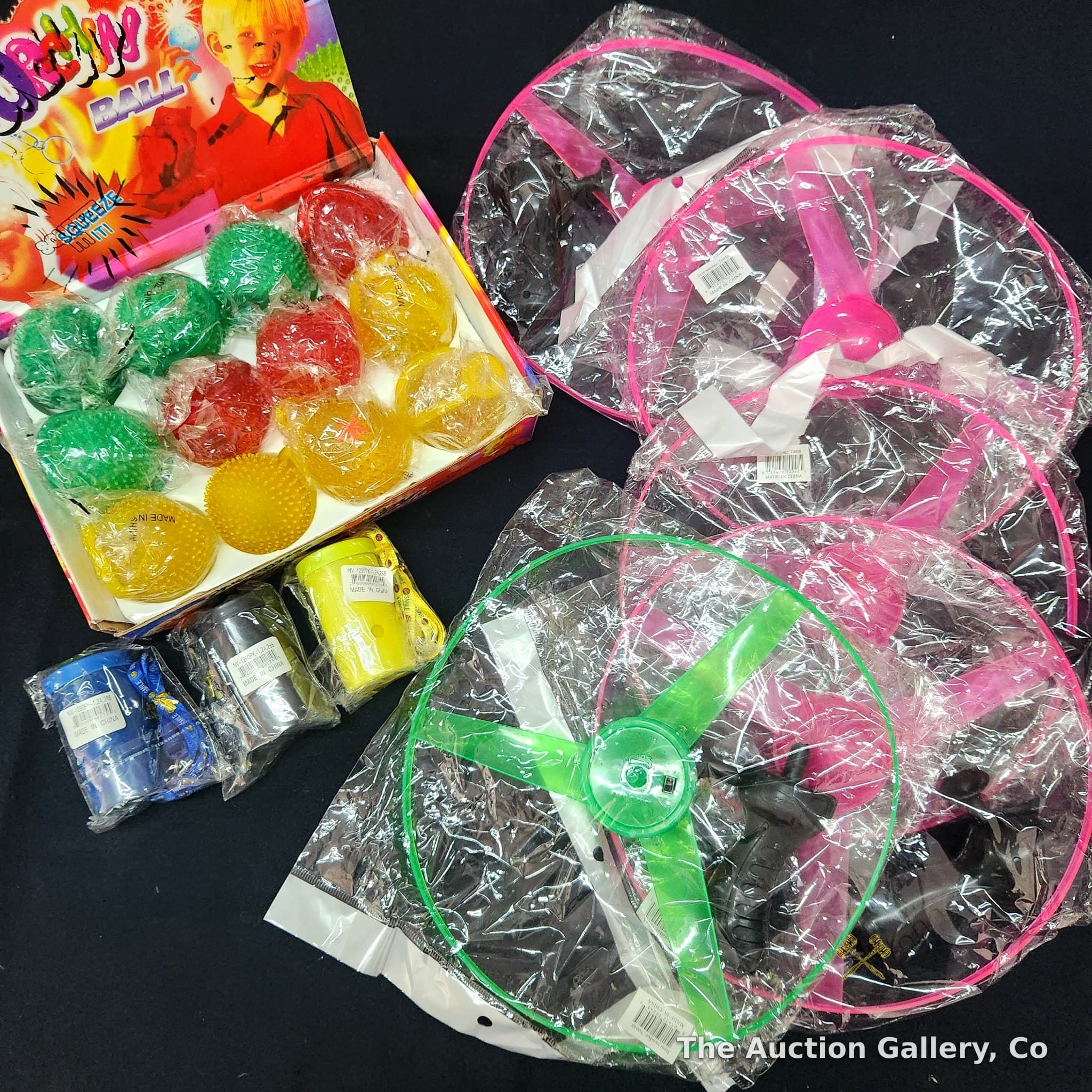 20pc Mixed Novelty Toy Lot โ 12 Sea Urchin Balls, 5 LED Flying Saucers, 3 Whistles