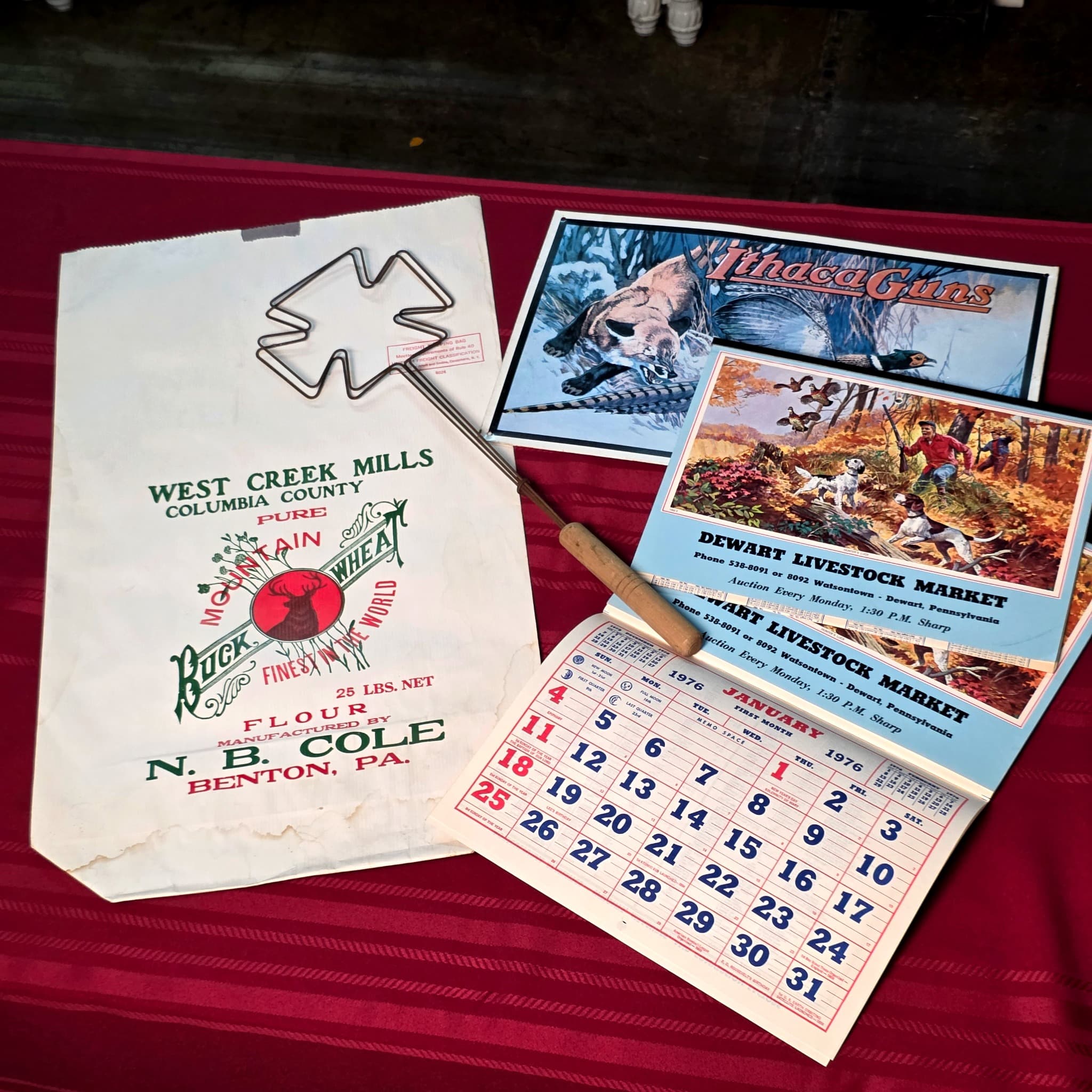 Pennsylvania Ephemera Lot β Ithaca Guns Sign, 1976 Calendars, Flour Bag & Carpet Beater